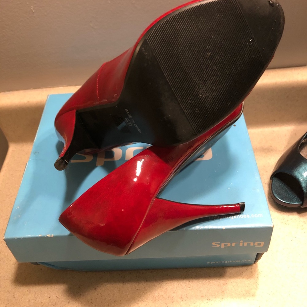 Gently worn red patent leather open toes pumps